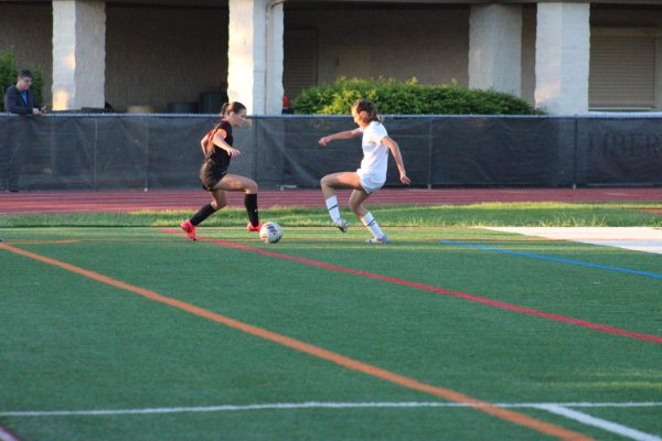 Senior Molly Koch (3) dribbles the ball and escapes the visiting Patriots. Koch scored the first goal of the game, giving the Wildcats a lead they retained for the rest of the game until their 3-0 win over Stevenson.