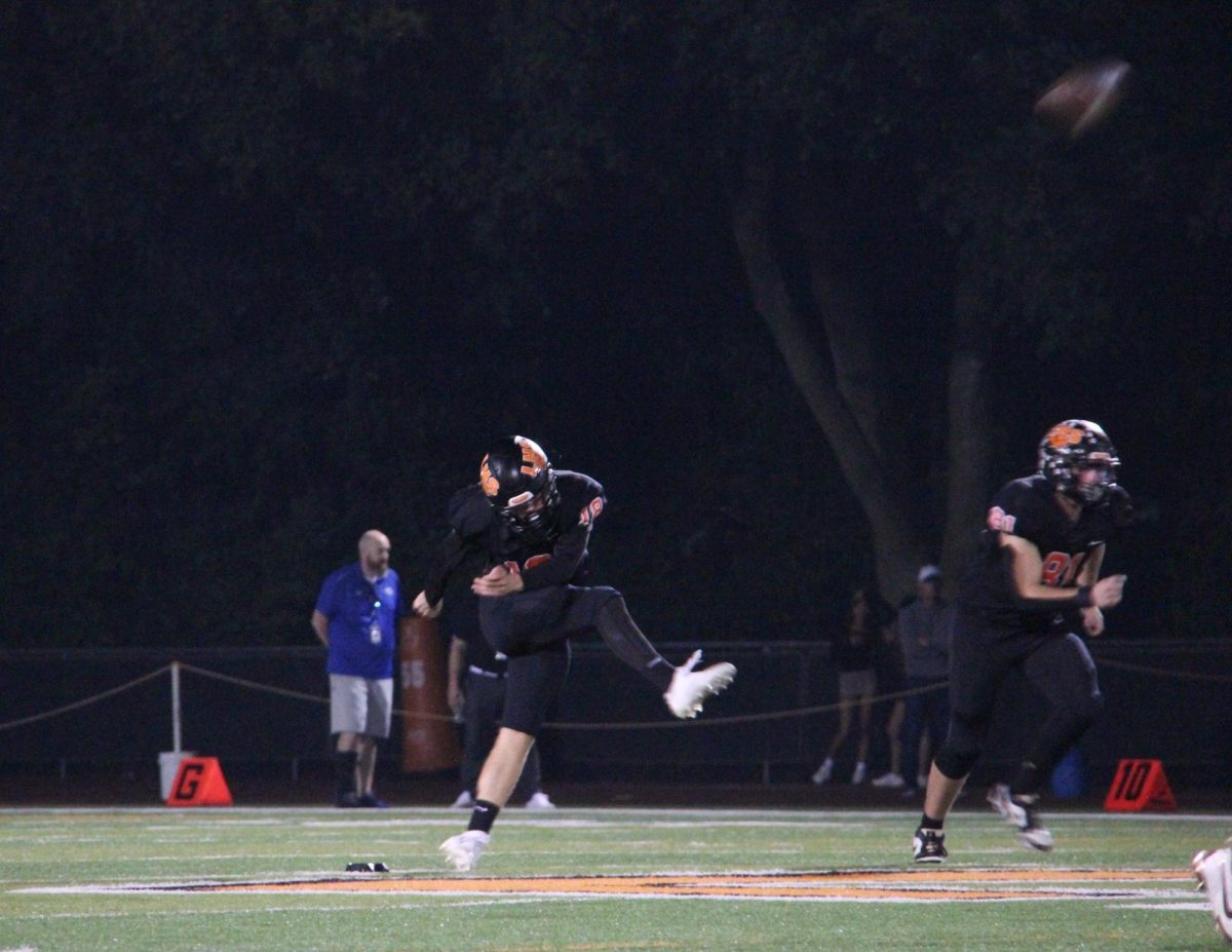 Senior punter Benjamin Ratner (18) scores his second field goal of the night racking up the score for the Wildcats.