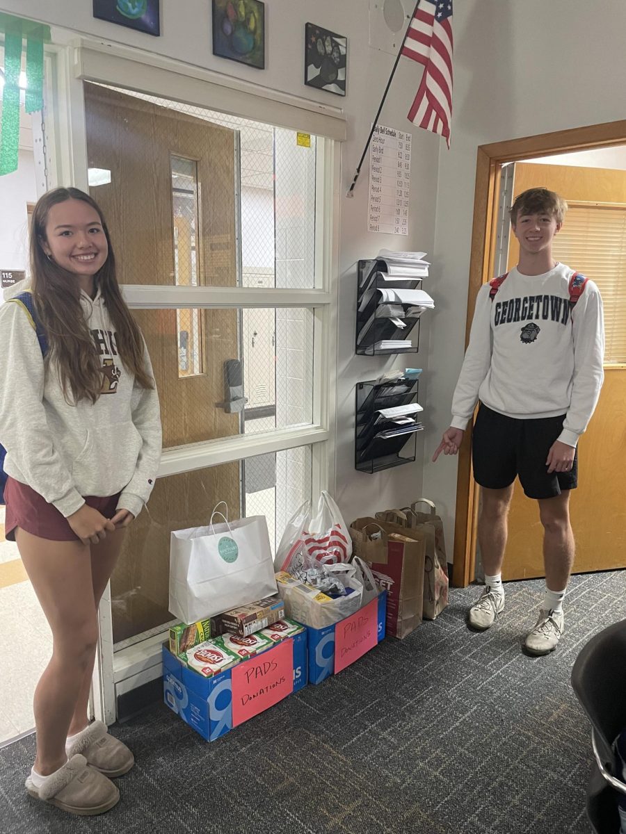 Seniors (left to right) Lena Dogadalksi and Noah Finnema prepare to deliver donations to the PADS charity, an organization which is dedicated to preventing homelessness in families.