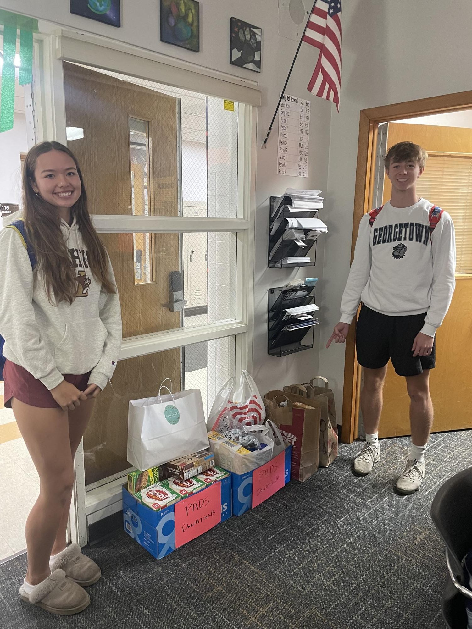 Seniors (left to right) Lena Dogadalksi and Noah Finnema prepare to deliver donations to the PADS charity, an organization which is dedicated to preventing homelessness in families.