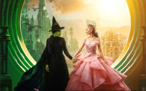 Elphaba and Galinda, characters portrayed by Cynthia Erivo and Ariana Grande, can be seen holding hands in front of the window which displays all of Oz. With their signature colors, this picture synthesizes many elements from the movie, such as the flying monkeys, Emerald City and Munchkinland.

Photo Courtesy of Creative Commons
