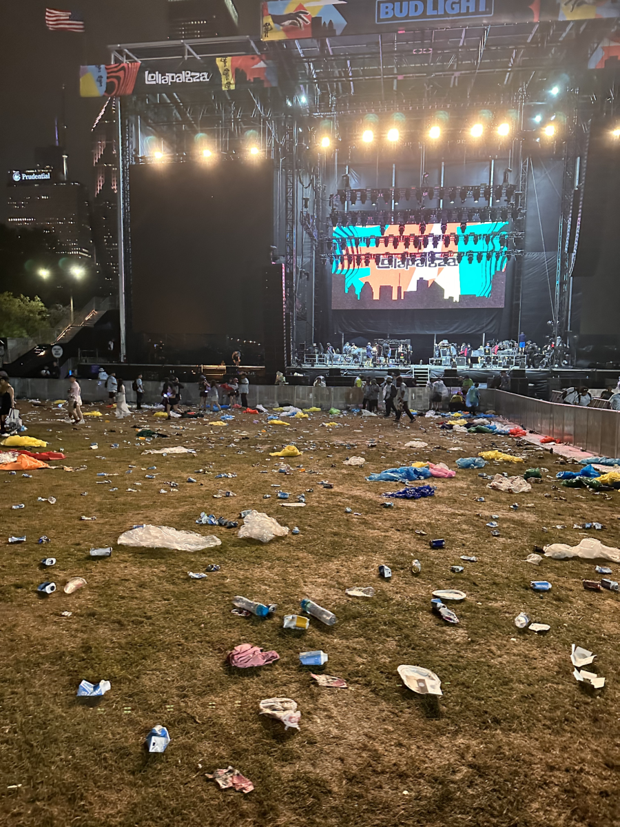 The standing area after the headlining performance at Lollapalooza Chicago 2023. The ground was covered with ponchos, water bottles, drink cans, and food wrappers. After working long hours in the heat, workers close their night by cleaning up somebody else’s trash. At the very least spectators should pick up their trash on their way out of the festival. 