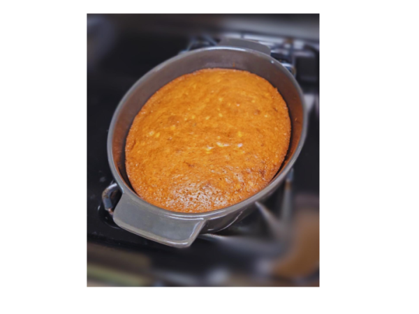 Freshly-made banana bread is cooling down, another example of a  well-loved comfort food. Many comfort foods are homemade recipes or pastries, such as this homemade bread. Traditional and homemade foods are often very nostalgic and comforting, thus making them popular comfort foods and popular in kitchens everywhere