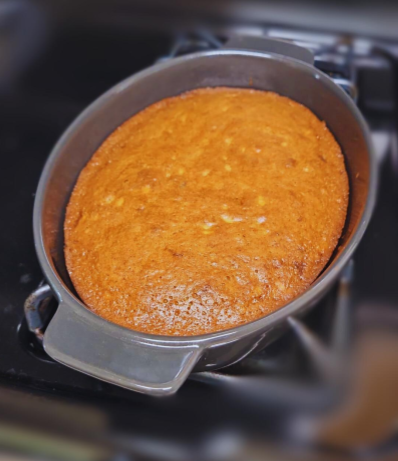 Freshly-made banana bread is cooling down, another example of a  well-loved comfort food. Many comfort foods are homemade recipes or pastries, such as this homemade bread. Traditional and homemade foods are often very nostalgic and comforting, thus making them popular comfort foods and popular in kitchens everywhere