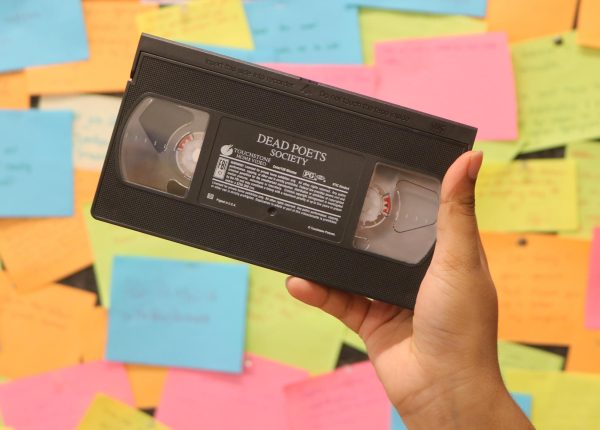 A VHS tape, an old form of recording and playing back video. The tape wraps and passes through the “head drum” and plays back both audio and video. Many old movies were recorded on these. 
