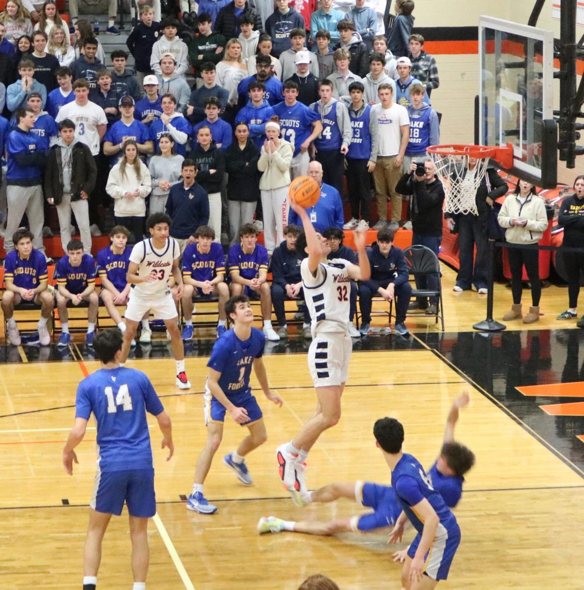 Junior Point Forward Bryce Wegrzyn (32) scores a layup against the Scouts’ defense. Bryce scored 11 points in the game on Tuesday, February 11, 2025.