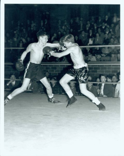 Peter Bennes, seen on the right, represents the Libertyville Boys Club (LBC) in a boxing match against the Mundelein Boys Club in the 1946-1947 season. LBC was originally founded as a boxing club in the late 1930s but soon grew in popularity into what is now known as the Libertyville Wildcats Youth Sports. Photo courtesy of the Libertyville Historical Society.